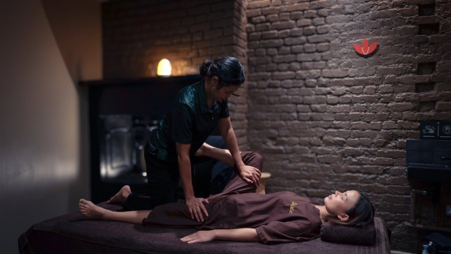 Therapist giving a Thai massage