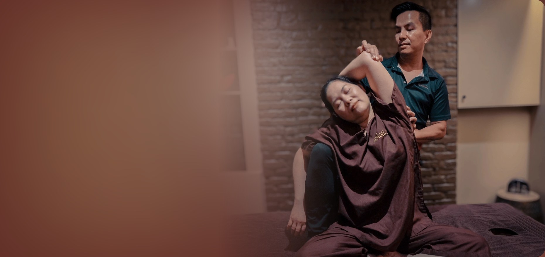 Therapist guiding an assisted Thai yoga stretch