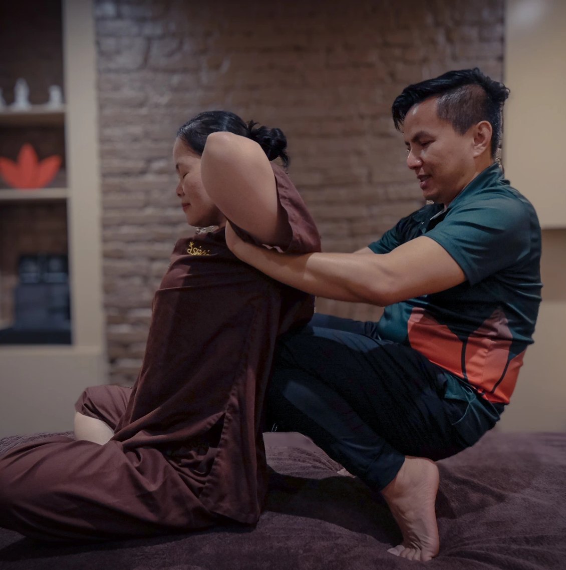 Therapist applying a supported back stretch